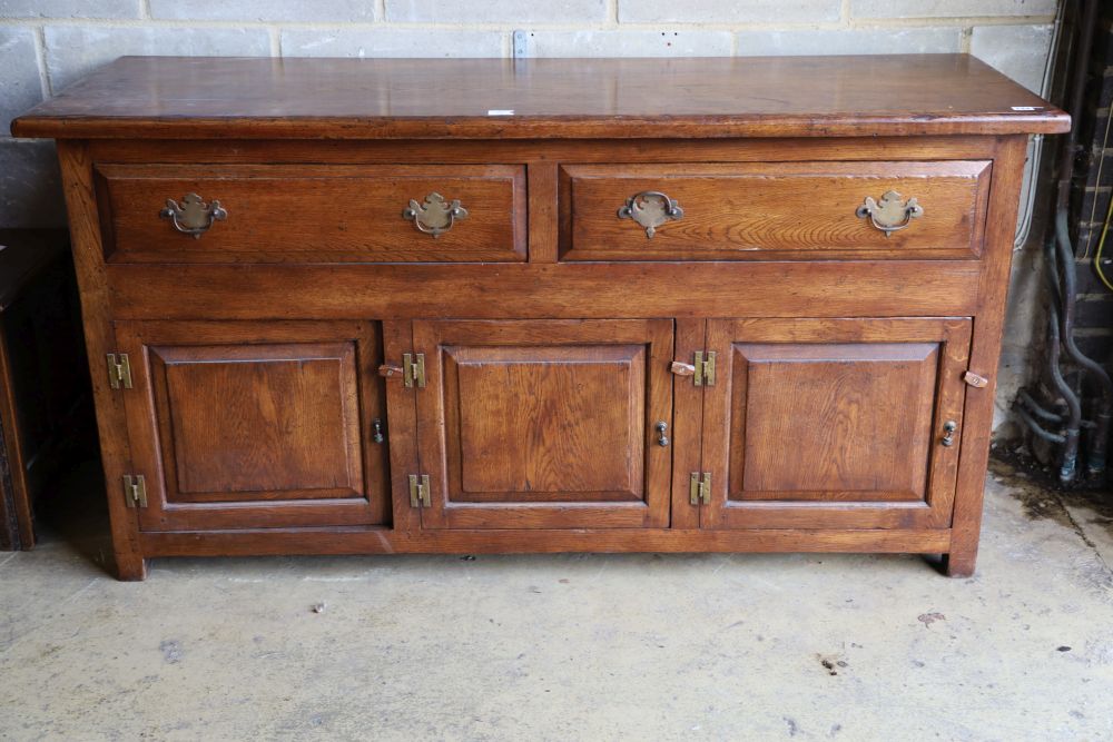 An 18th century style oak low dresser, width 168cm, depth 58cm, height 86cm